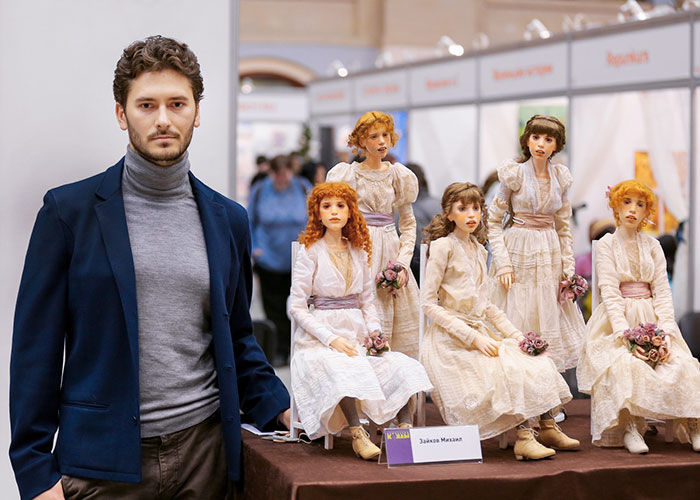 Michael Zajkov with his hyper-realistic dolls